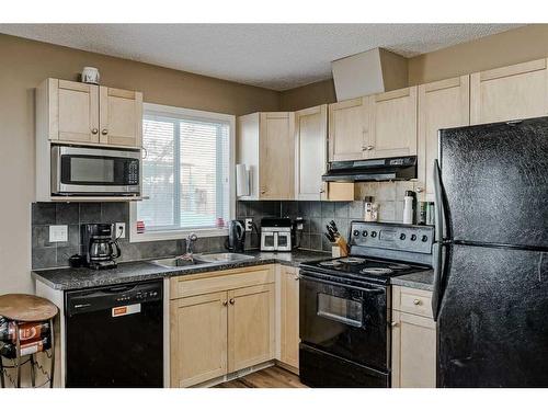 140 Royal Oak Gardens Nw, Calgary, AB - Indoor Photo Showing Kitchen With Double Sink