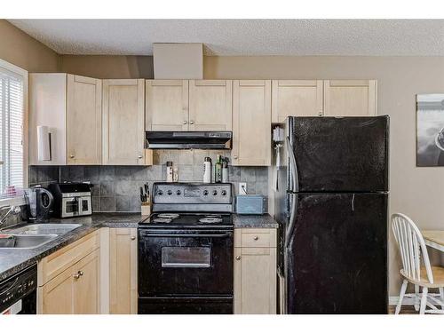 140 Royal Oak Gardens Nw, Calgary, AB - Indoor Photo Showing Kitchen With Double Sink