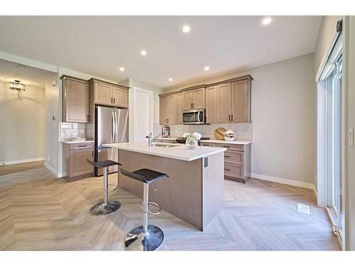 48 Shawnee Green Sw, Calgary, AB - Indoor Photo Showing Kitchen With Stainless Steel Kitchen