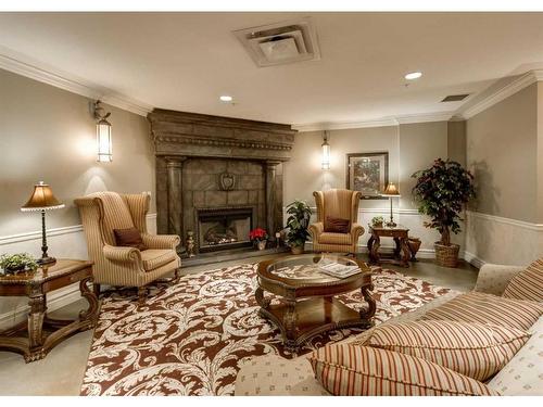 404-1726 14 Avenue Nw, Calgary, AB - Indoor Photo Showing Living Room With Fireplace