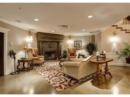 404-1726 14 Avenue Nw, Calgary, AB - Indoor Photo Showing Living Room With Fireplace