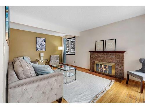 6724 Silverdale Road Nw, Calgary, AB - Indoor Photo Showing Living Room With Fireplace