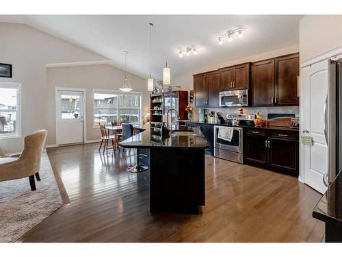 28 Jumping Pound Rise, Cochrane, AB - Indoor Photo Showing Kitchen With Upgraded Kitchen