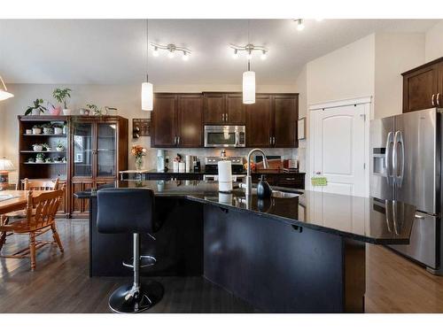 28 Jumping Pound Rise, Cochrane, AB - Indoor Photo Showing Kitchen With Upgraded Kitchen