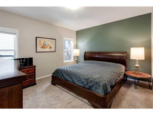 28 Jumping Pound Rise, Cochrane, AB - Indoor Photo Showing Bedroom