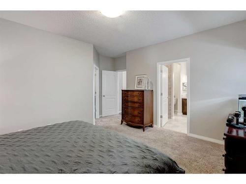 28 Jumping Pound Rise, Cochrane, AB - Indoor Photo Showing Bedroom