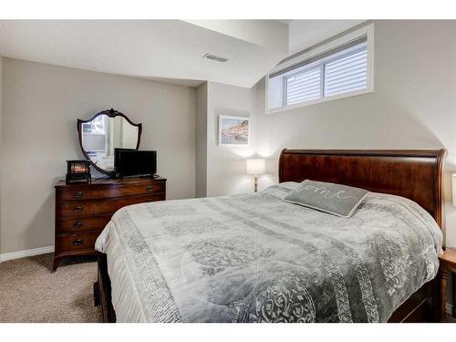 28 Jumping Pound Rise, Cochrane, AB - Indoor Photo Showing Bedroom