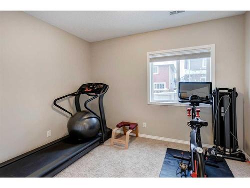 28 Jumping Pound Rise, Cochrane, AB - Indoor Photo Showing Gym Room