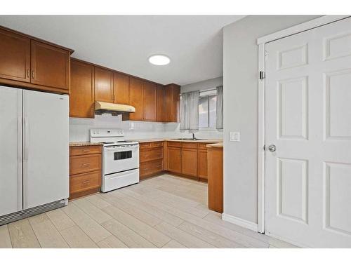 6768 Malvern Road, Calgary, AB - Indoor Photo Showing Kitchen With Double Sink