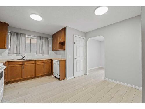 6768 Malvern Road, Calgary, AB - Indoor Photo Showing Kitchen With Double Sink