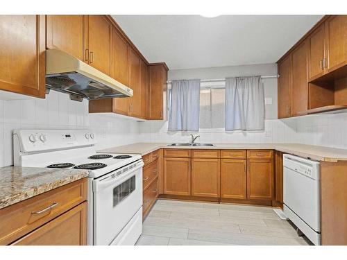 6768 Malvern Road, Calgary, AB - Indoor Photo Showing Kitchen With Double Sink