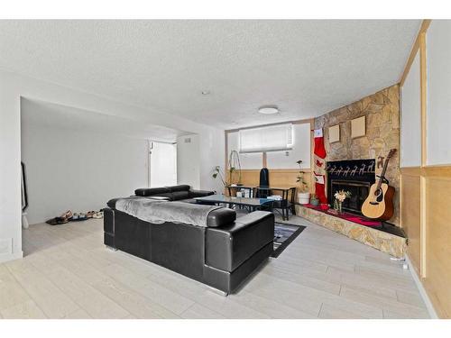 6768 Malvern Road, Calgary, AB - Indoor With Fireplace