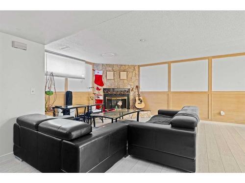 6768 Malvern Road, Calgary, AB - Indoor Photo Showing Living Room With Fireplace