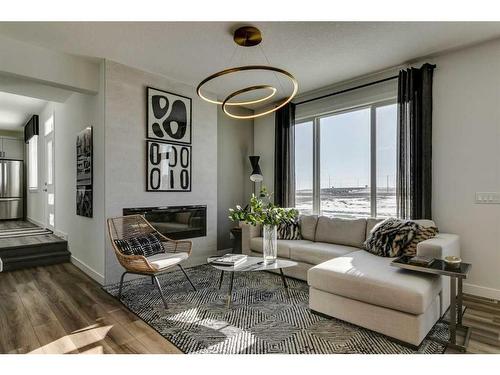 644 Buffaloberry Manor Se, Calgary, AB - Indoor Photo Showing Living Room With Fireplace