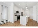 2403-111 Wolf Creek Drive Se, Calgary, AB  - Indoor Photo Showing Kitchen With Upgraded Kitchen 