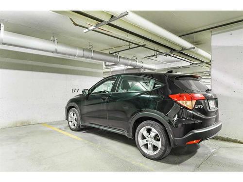 208-120 Country Village Circle Ne, Calgary, AB - Indoor Photo Showing Garage