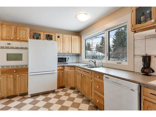 1132 Lake Sylvan Place Se, Calgary, AB - Indoor Photo Showing Kitchen With Double Sink