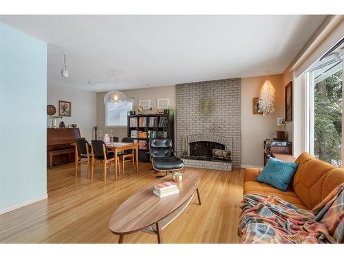 1132 Lake Sylvan Place Se, Calgary, AB - Indoor Photo Showing Living Room With Fireplace