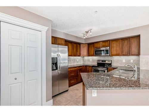 228-500 Rocky Vista Gardens Nw, Calgary, AB - Indoor Photo Showing Kitchen With Double Sink