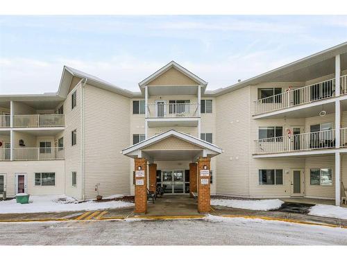 215-3 Parklane Way, Strathmore, AB - Outdoor With Balcony With Facade