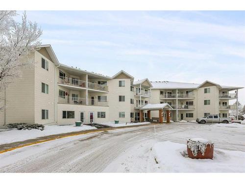 215-3 Parklane Way, Strathmore, AB - Outdoor With Balcony With Facade