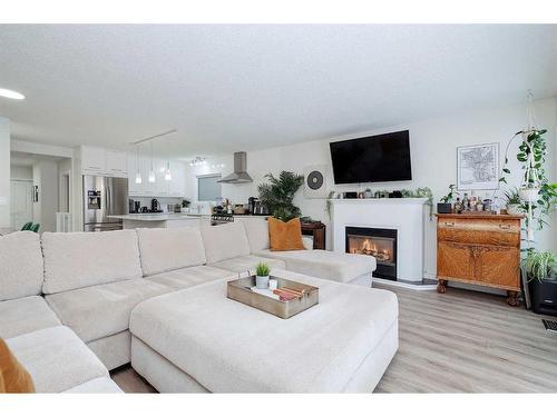 2004 7 Avenue Nw, Calgary, AB - Indoor Photo Showing Living Room With Fireplace