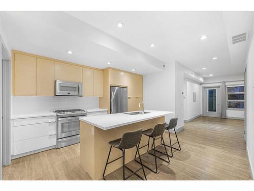 203-1707 27 Avenue Sw, Calgary, AB - Indoor Photo Showing Kitchen With Stainless Steel Kitchen With Double Sink With Upgraded Kitchen