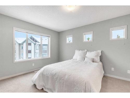 214 Copperpond Row Se, Calgary, AB - Indoor Photo Showing Bedroom