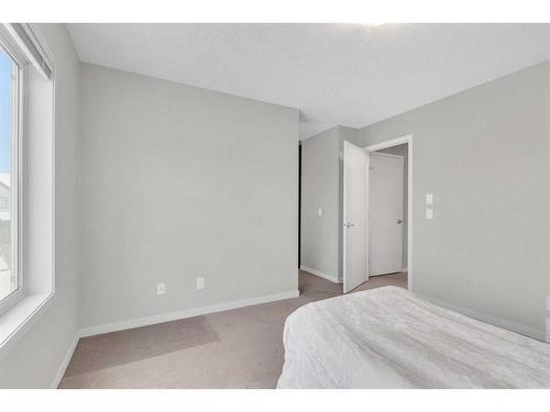 214 Copperpond Row Se, Calgary, AB - Indoor Photo Showing Bedroom