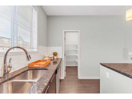 214 Copperpond Row Se, Calgary, AB - Indoor Photo Showing Kitchen With Double Sink