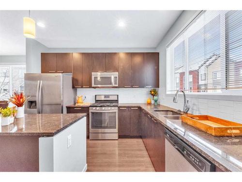 214 Copperpond Row Se, Calgary, AB - Indoor Photo Showing Kitchen With Stainless Steel Kitchen With Double Sink With Upgraded Kitchen