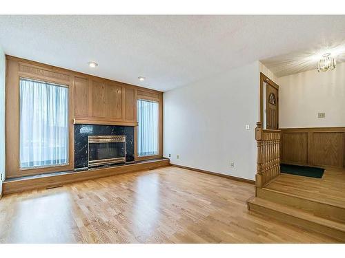 2810 Catalina Boulevard Ne, Calgary, AB - Indoor Photo Showing Living Room With Fireplace