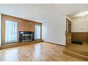 2810 Catalina Boulevard Ne, Calgary, AB  - Indoor Photo Showing Living Room With Fireplace 