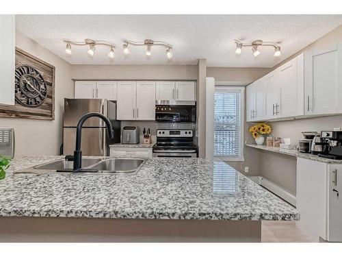 2140-81 Legacy Boulevard Se, Calgary, AB - Indoor Photo Showing Kitchen With Double Sink With Upgraded Kitchen