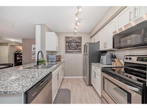 2140-81 Legacy Boulevard Se, Calgary, AB - Indoor Photo Showing Kitchen With Stainless Steel Kitchen With Double Sink