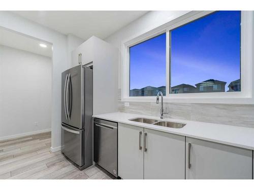 97 Corner Glen Way Ne, Calgary, AB - Indoor Photo Showing Kitchen With Double Sink