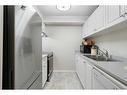 2217-6224 17 Avenue Se, Calgary, AB  - Indoor Photo Showing Kitchen With Double Sink 