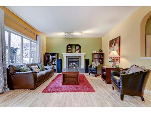 304 Oakmere Way, Chestermere, AB - Indoor Photo Showing Living Room With Fireplace