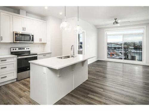 421-40 Walgrove Se, Calgary, AB - Indoor Photo Showing Kitchen With Stainless Steel Kitchen With Double Sink With Upgraded Kitchen