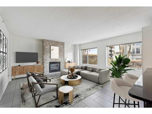 110-114 15 Avenue Sw, Calgary, AB - Indoor Photo Showing Living Room With Fireplace