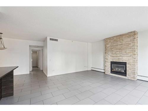 110-114 15 Avenue Sw, Calgary, AB - Indoor With Fireplace