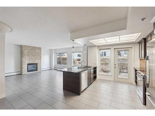 110-114 15 Avenue Sw, Calgary, AB - Indoor With Fireplace