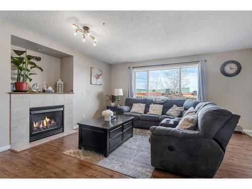 141 West Lakeview Point, Chestermere, AB - Indoor Photo Showing Living Room With Fireplace