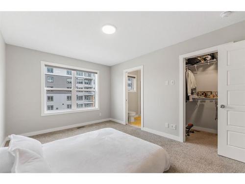 283 Wolf Creek Way Se, Calgary, AB - Indoor Photo Showing Bedroom