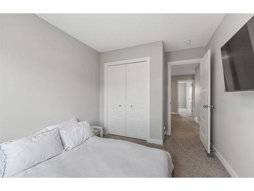 283 Wolf Creek Way Se, Calgary, AB - Indoor Photo Showing Bedroom