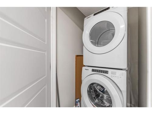 283 Wolf Creek Way Se, Calgary, AB - Indoor Photo Showing Laundry Room