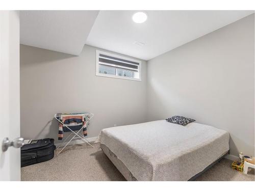 283 Wolf Creek Way Se, Calgary, AB - Indoor Photo Showing Bedroom