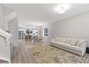 283 Wolf Creek Way Se, Calgary, AB  - Indoor Photo Showing Living Room 