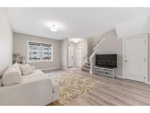 283 Wolf Creek Way Se, Calgary, AB - Indoor Photo Showing Living Room