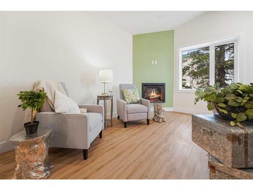 25-610 4 Avenue Sw, Sundre, AB - Indoor Photo Showing Living Room With Fireplace